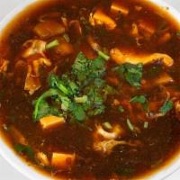 Chicken Hot And Sour Soup · Red chili, soy sauce, tofu, mushroom and cilantro. Hot and spicy.