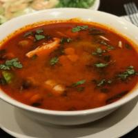 Chicken Tom Yum Soup · Thai chili sauce, mushroom, flavored with lemon grass and Thai ginger. Hot and spicy.