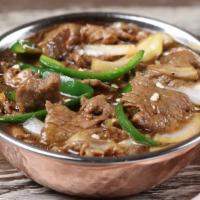 Chilli Beef (Gravy) · Stir fried beef in a manchurian sauce, onion and green chili. Hot and spicy.