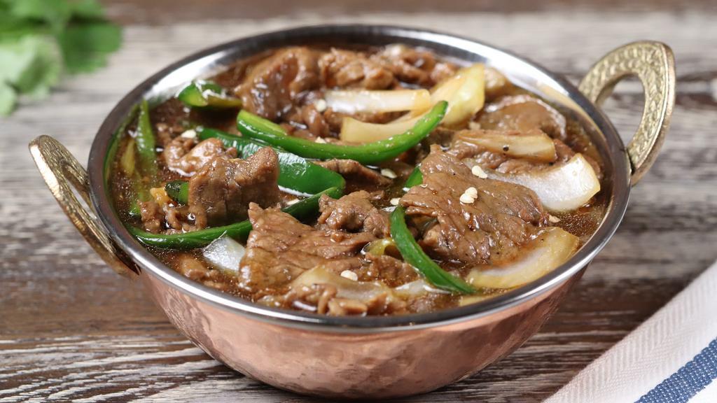 Chilli Beef (Gravy) · Stir fried beef in a manchurian sauce, onion and green chili. Hot and spicy.
