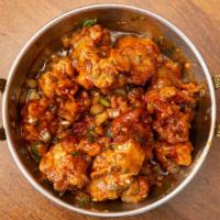 Chili Chicken · Batter fried chicken cube in a Manchurian sauce, onion & green chili. Hot and spicy.