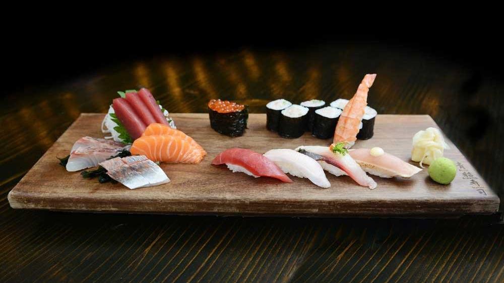 Sushi & Sashimi Combo · Six pieces of sushi, nine pieces of sashimi, and a yellowtail roll.