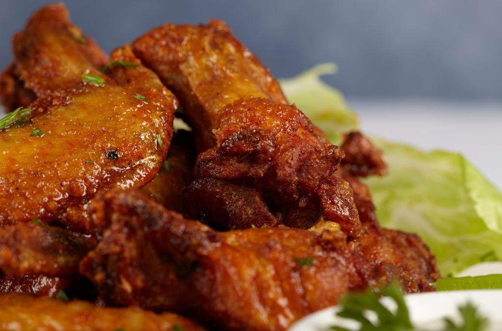Buffalo Wings · Tangy and spicy , blue cheese dipping, celery sticks.