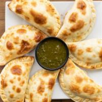 3 Chicken Empanadas  · ground chicken, onions, green and red peppers, and spices