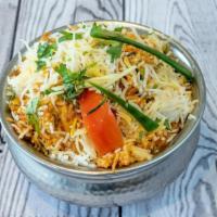 Chicken Biryani · Basmati rice saffron flavored, sealed with Chicken and cooked on slow fire to seal the flavo...