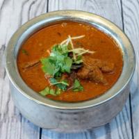Lamb Vindaloo · Lamb cubes, aged vinegar, onions, mustard and a blend of spices — a Goan specialty.