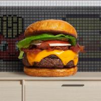 Bacon Burger · American beef patty topped with melted cheese, layers of crispy bacon, lettuce, tomato, onio...