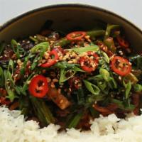 Chili Chicken · Chicken stir fried in a Spicey chili sauce and  Served with White Rice.