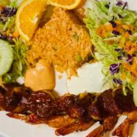 Camarones A La Diabla · Shrimp devil. served with spicy red sauce, white rice, salad (shredded carrots, lettuce, cuc...