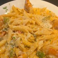 Shrimp Tequila  · penne pasta served in a creamy pink tequila sauce, with sautéed ,peppers,onios,jalapenos,cil...