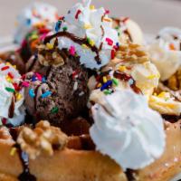 Belgian Waffle Sundae · Golden crisp belgian waffle with two scoops of your favorite ice cream nuts chocolate syrup ...