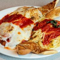 Chicken Breast Parmigiana · served with Linguini