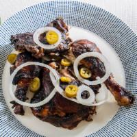 Jerk Chicken · Baked Chicken Seasoned with our Home-Made Jerk Marinade with Grilled Onions and Jalapeno pep...