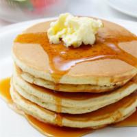 Pancakes · Three fluffy, delicious pancakes, served with butter and syrup on the side.