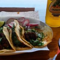 Tacos De Barbacoa De Res (Beef Barbacoa Tacos)(4) · Comes with onions and cilantro on the taco. On the side comes with radish, limes and scallio...