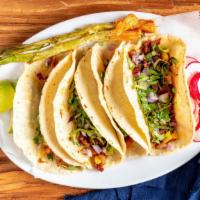 Tacos Al Pastor (Pork Tacos)(4) · Comes with onions, cilantro and pineapple on the taco. On the side comes with radish, limes ...