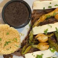 Bistec Al Estilo Guerrero (Warrior Style Steak) · Bean, cheese, onion, and tortillas.