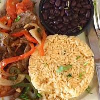 Salteado De Res (Sauteed Beef) · Sautéed beef in onions, peppers, tomato. Served with rice, beans, and tortillas.