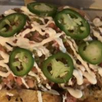 Cowboy Nachos · House made tortilla chips, chicken, cheese sauce, black beans, pico De gallo, lime, sour cre...