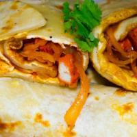 Kathi Roll · Traditional pan-fried ‘paratha’(flat bread) rolled with a skewer. Stuff with your choice of ...