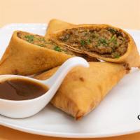 Chicken Samosa · Deep fried crispy, triangular pastry filled with aromatic chicken and peas filling served wi...