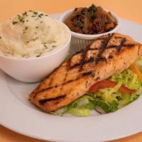 Grilled Salmon · Seasoned and grilled salmon fillets with garlicky, middle eastern flavored sauce and served ...