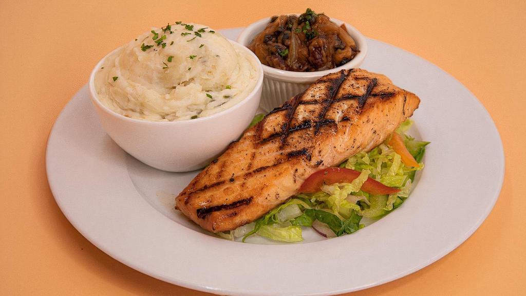 Grilled Salmon · Seasoned and grilled salmon fillets with garlicky, middle eastern flavored sauce and served with side of mash, saffron rice, and mixed beans.