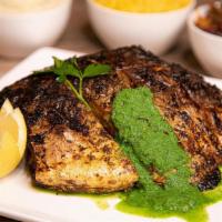 Grilled Fish W/ Lemon Basil Dressing · Succulent golden Pompano grilled with olive oil, garlic, and herbs. Served with mash, sautée...