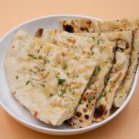 Garlic Naan · This flat-bread has a smoky flavor from roasted garlic, mashed and mixed with the. dough