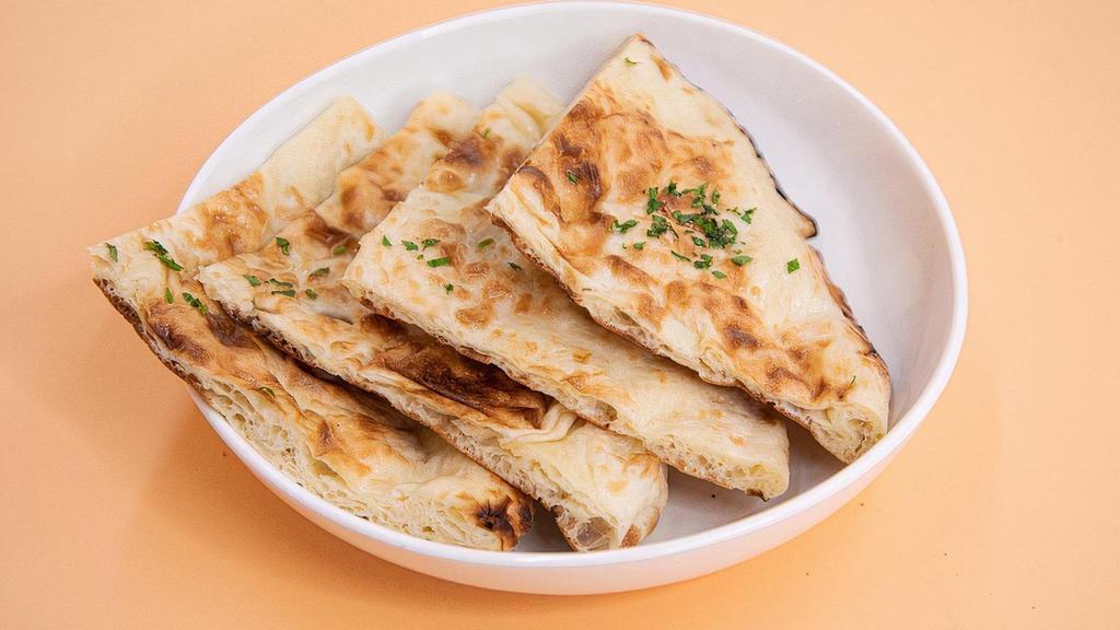 Naan · Traditional oven-baked flatbread.