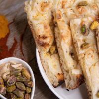 Nawabi Naan · The most wanted flat-bread, made from flour enriched with roasted almonds, pistachios and ca...