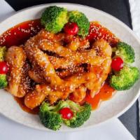 Sesame Chicken · Big chunks of chicken with broccoli on the bottom, served with sesame sauce.