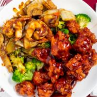 Dragon & Phoenix · Two dishes served on a single plate, jumbo shrimp with variety of vegs in special sauce on o...