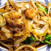 Triple Delight · Chicken, shrimp, and beef with mixed vegetables in brown sauce.