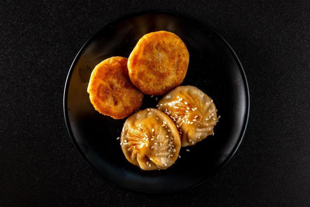 P2 Potstickers - Spicy Pork · Golden crusted pan-fried dot dumplings, spicy pork fillings.