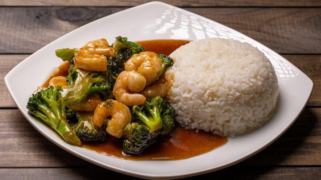Shrimp W. Broccoli Over Rice / 芥兰虾飯 · Shrimp is stir-fried with broccoli and topped with light sauce. Served with rice. 
Ingredients: Shrimp, broccoli, and rice.
