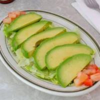 Sliced Avocado Salad · Ripe avocados sliced on a bed of lettuce with lime vinaigrette.