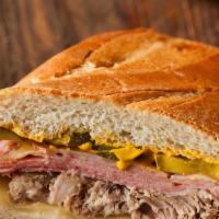 Cubano Sandwich · Ham, Pork swiss, pickle, mustard.