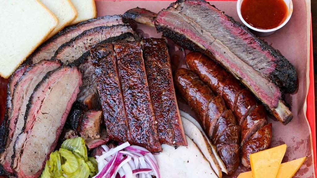 Texas Bbq Family Combo (Design For 2-3 Person 5 Course Meal)   · Full bbq baby rib
3-links bbq sausage
3-corn bread
8oz coleslaw
4oz bbq sauce
choice of white rice or saffron rice or FF
1-2lt soda
choice of cheese cake or tiramisu