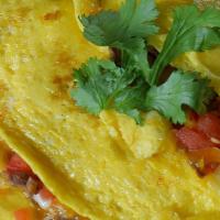 Tex-Mex Omelette · Sauteed veges , hot chili, cheddar cheese top with avocado & 