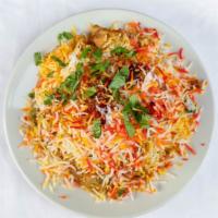 Chicken Biriyani · Basmati rice cooked with chicken, spices and herbs. A south Asian favorite dish.
