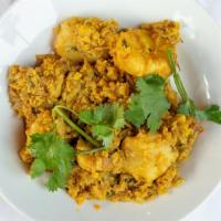 Aloo  Gobi · Potatoes and cauliflower cooked with spices and herbs.