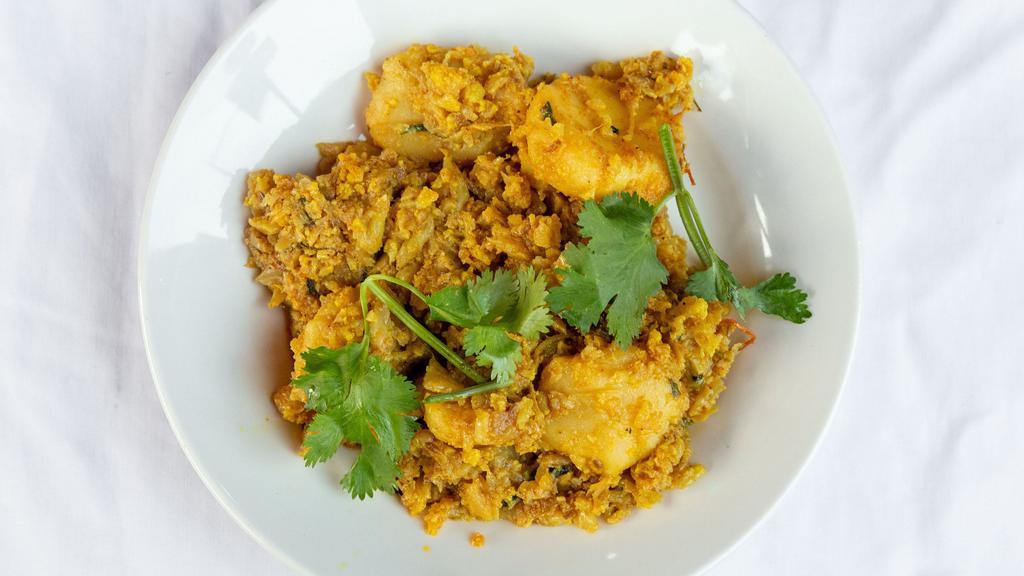 Aloo  Gobi · Potatoes and cauliflower cooked with spices and herbs.