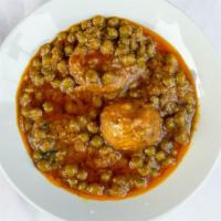Aloo Mattar · Potatoes and green peas cooked with spices and herbs.