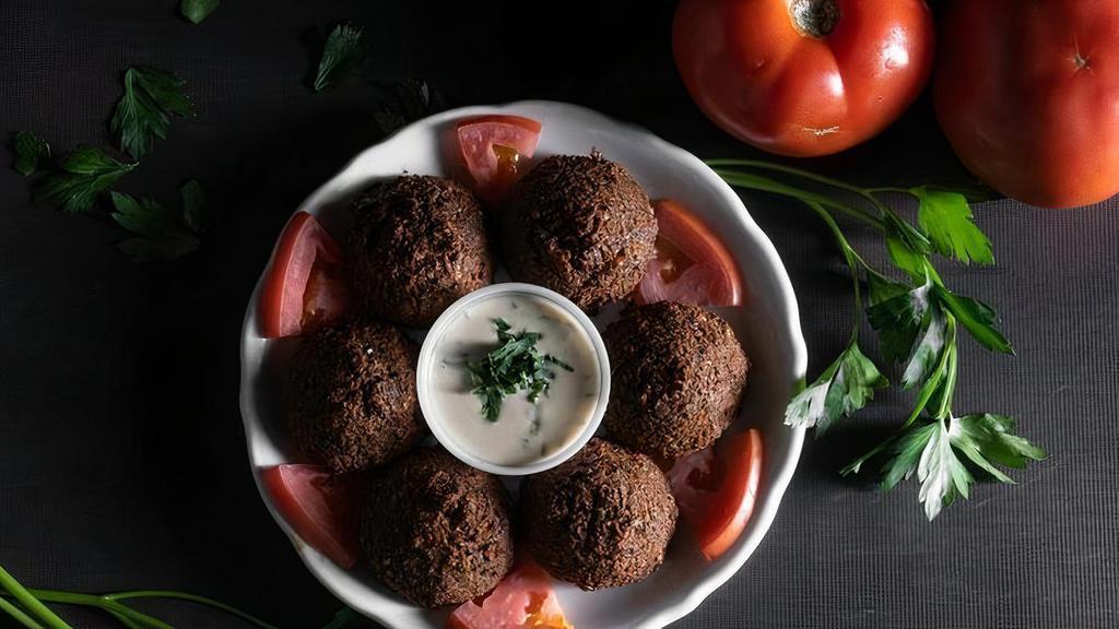 Falafel · Finely ground chickpeas, onions, parsley, garlic & spices deep fried