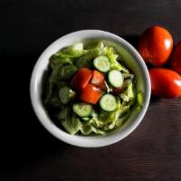 House Salad · Romaine lettuce, cucumbers, tomatoes, onion, vinegar & oil