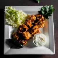 Shish Tawook · Grilled marinated cubes of skewered chicken breast