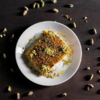 Knafeh · Sweet cheese pastry soaked in sweet, sugar-based syrup, garnished with pistachios