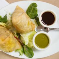 Vegetable Samosa · Pastry stuffed with potatoes and green peas with tamarind sauce.