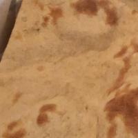 Tandoori Roti · Unleavened whole wheat bread baked in the tandoor oven.